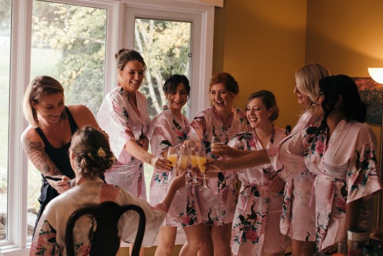 Bridesmaids get ready in pink robes